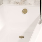 Lifestyle image of Crosswater 3ONE6 Brushed Brass Bath Filler with Click-Clack Waste
